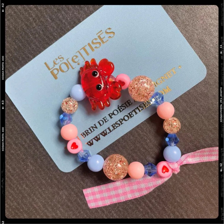 Les Poétisés bracelet crabe enfant bleu rose rouge