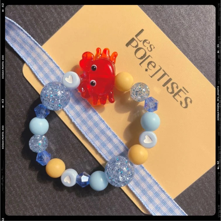 Les Poétisés bracelet enfant crabe bleu jaune rouge